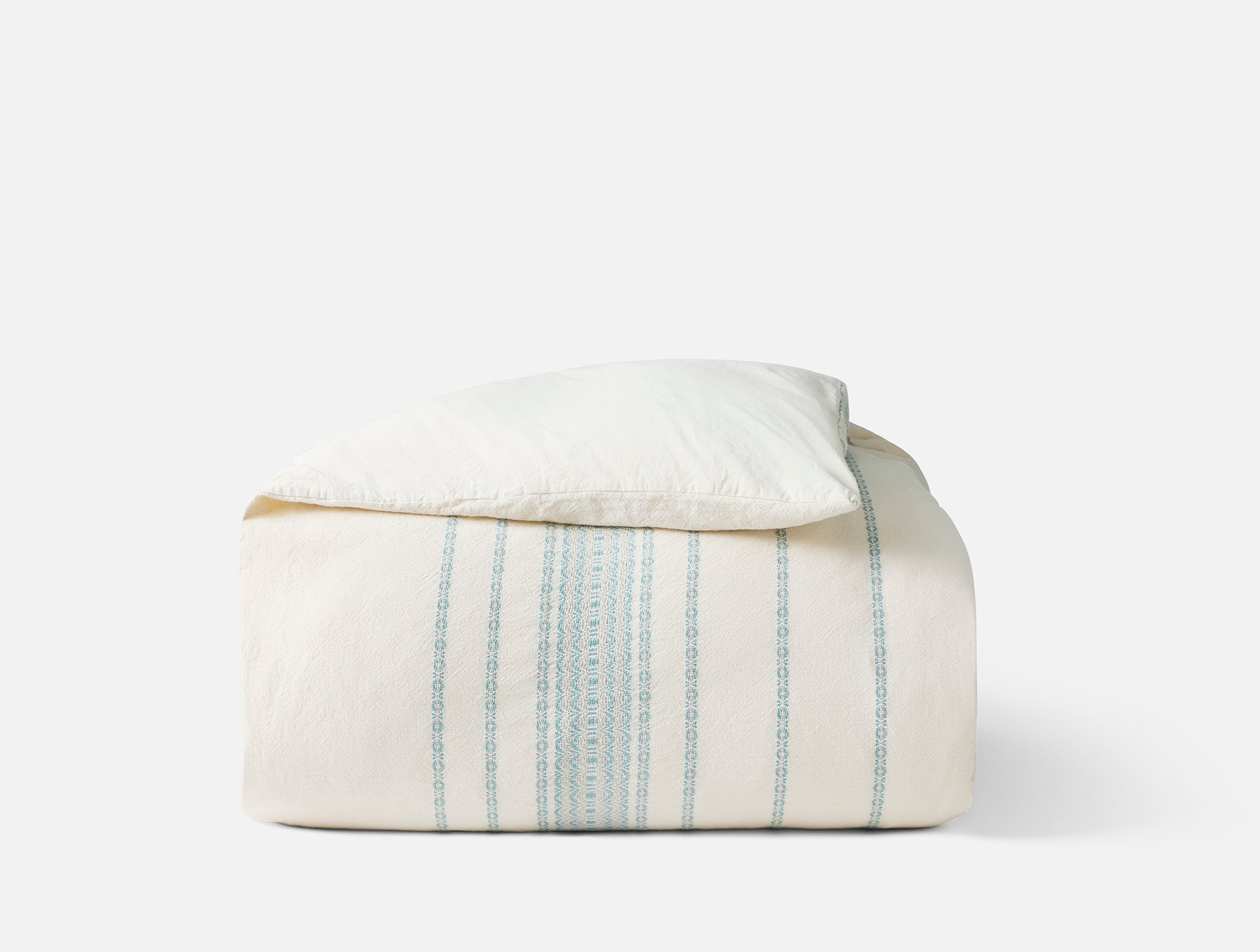 Coyuchi Organic Rippled Stripe Duvet Cover - folded #colour_undyed w/ surf