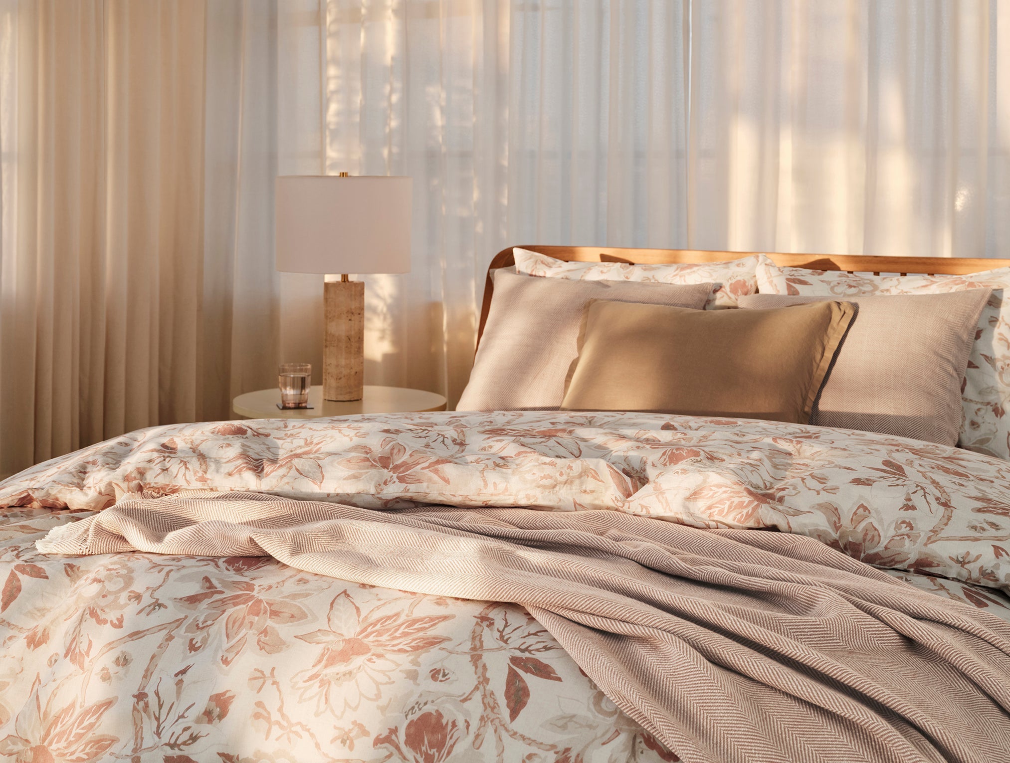 Coyuchi Organic Sea Bloom Print Duvet Cover - lifestyle soft lighting lamp on bedside table #colour_Natural w/Praline