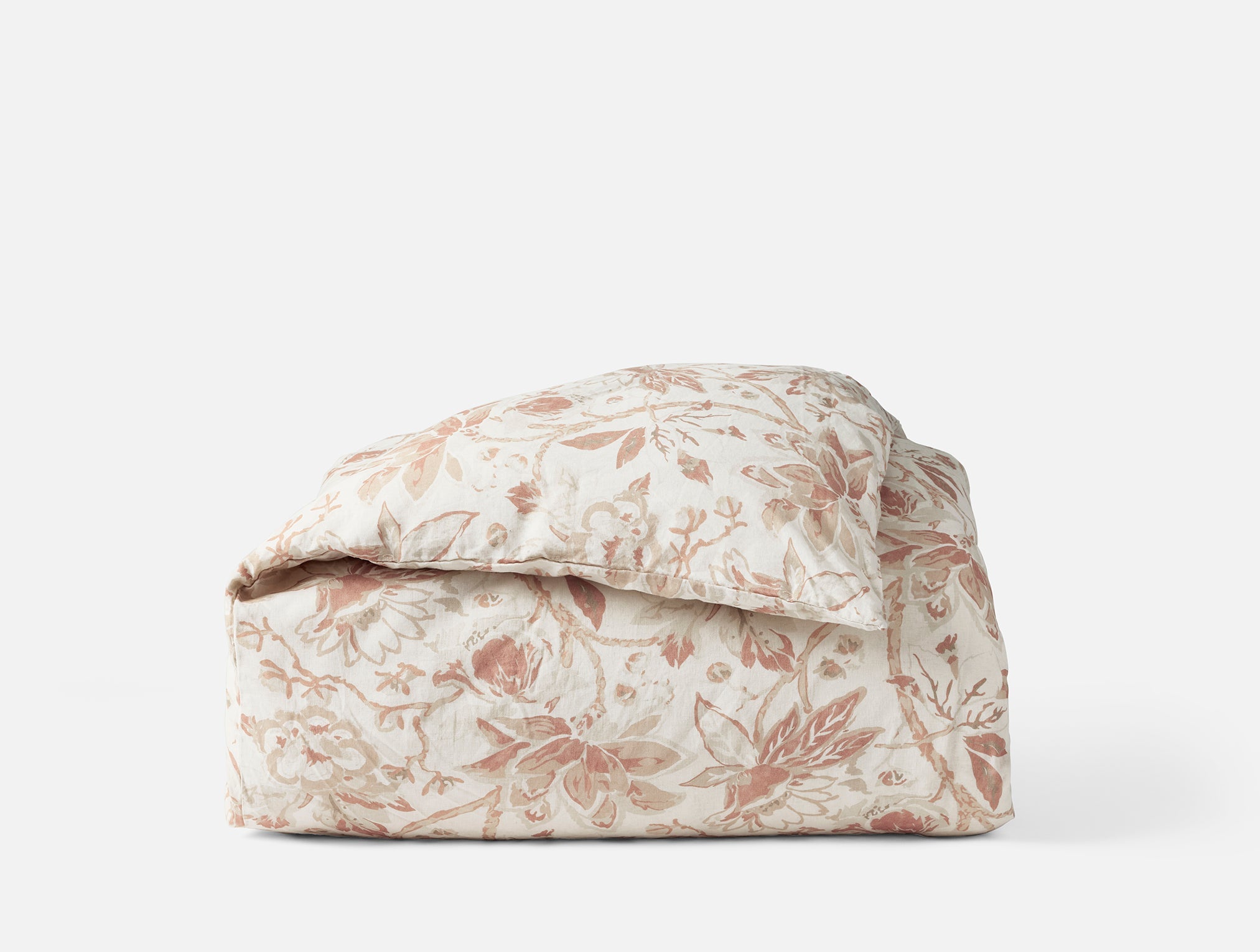 Coyuchi Sea Bloom Print Duvet Cover in Natural w/ Praline – folded, with corner showing print details and seam. #colour_Natural w/Praline