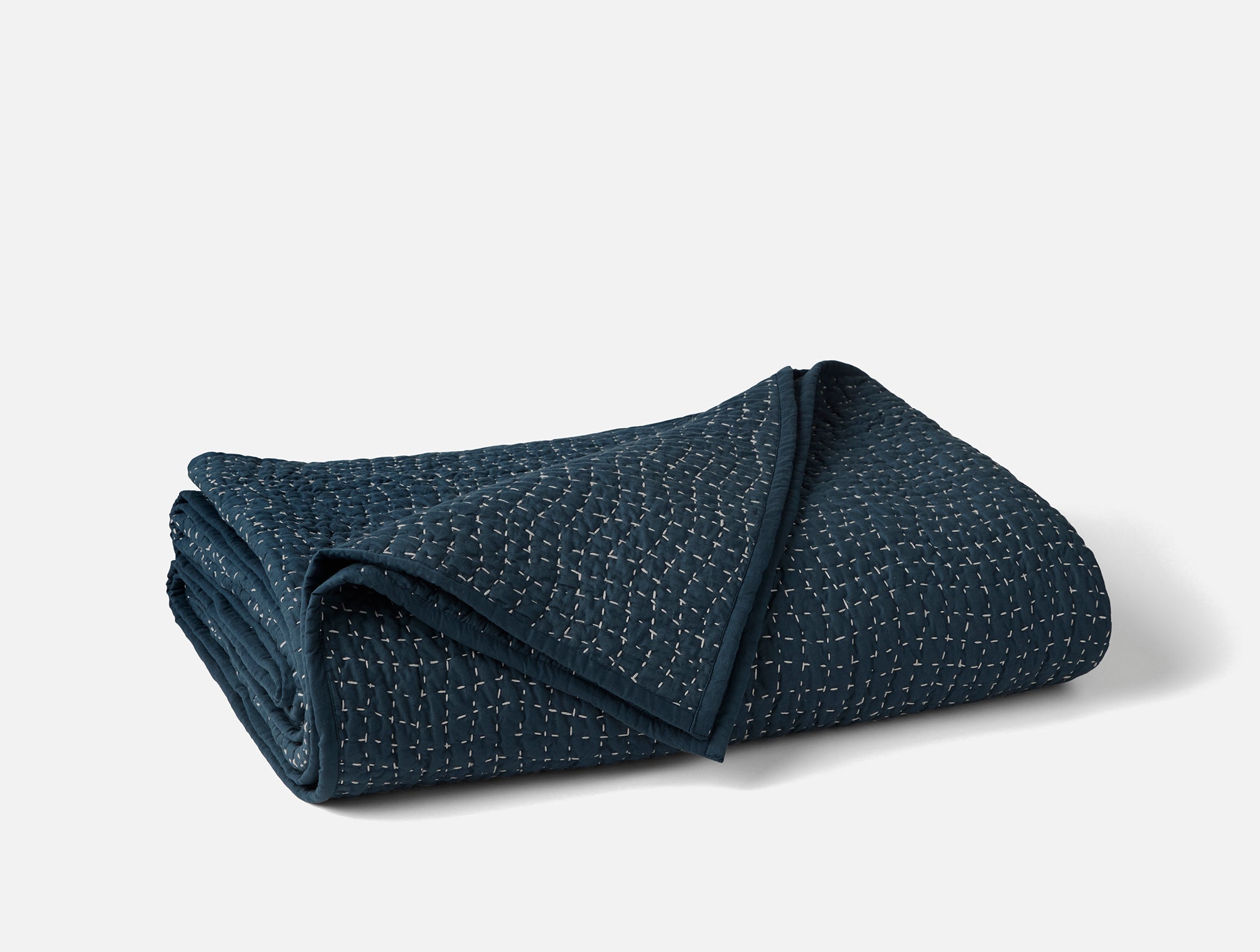 Coyuchi Organic Pebbled Hand Stitched Quilt in Midnight Indigo - folded  #colour_midnight indigo
