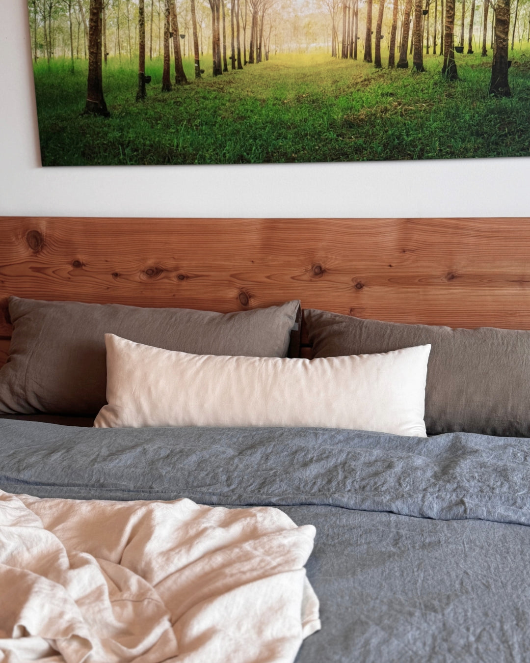 Kakun Lumbar Pillow - on natural wood bed