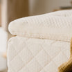 Kakun Organic Luxury Topper - on a mattress close up of corner