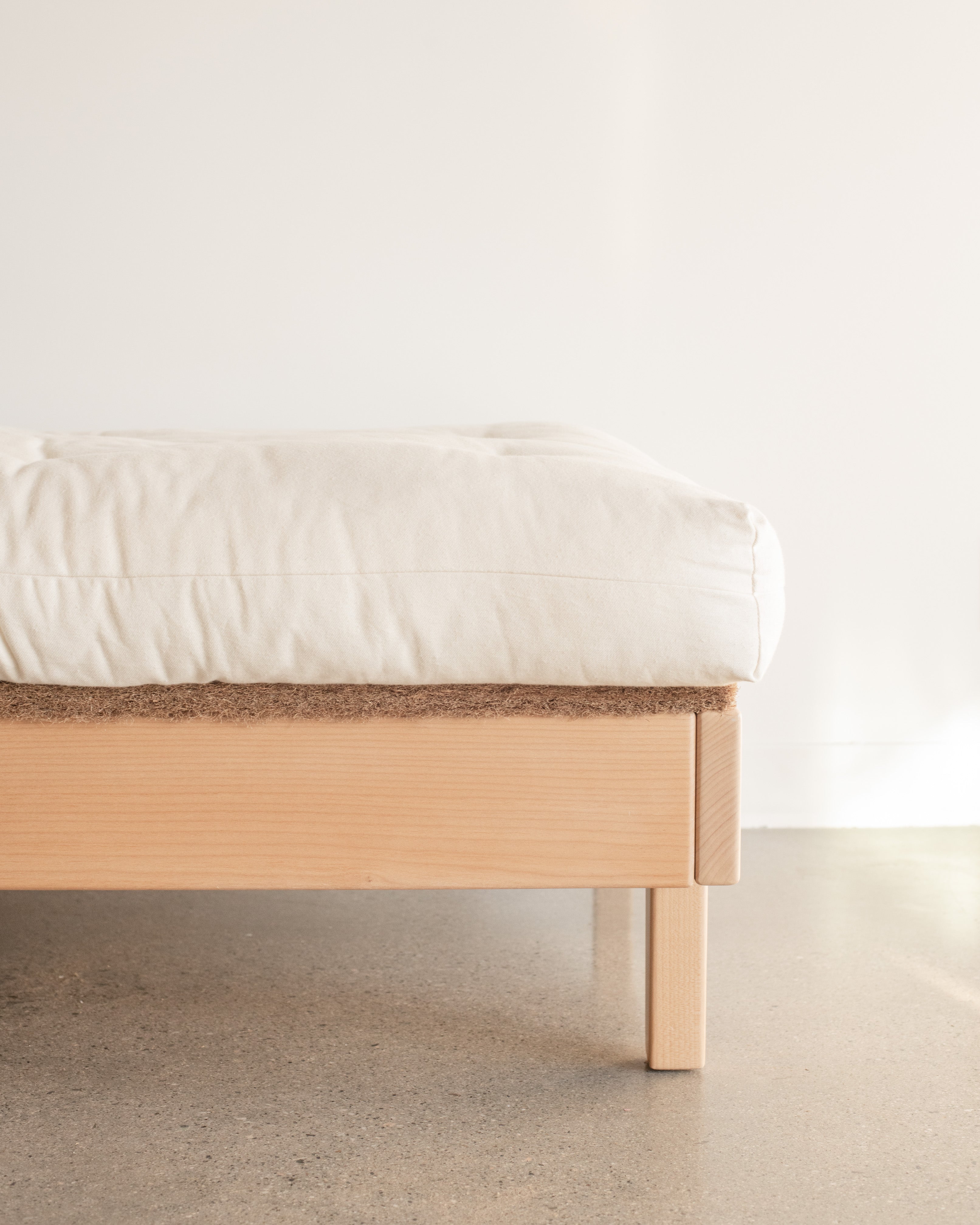 Kakun Organic Coconut Coir Bed Rug on a bedframe with mattress on top