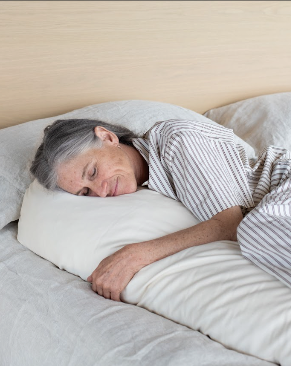 Kakun Organic Wool Body Pillow - view from front of model hugging pillow