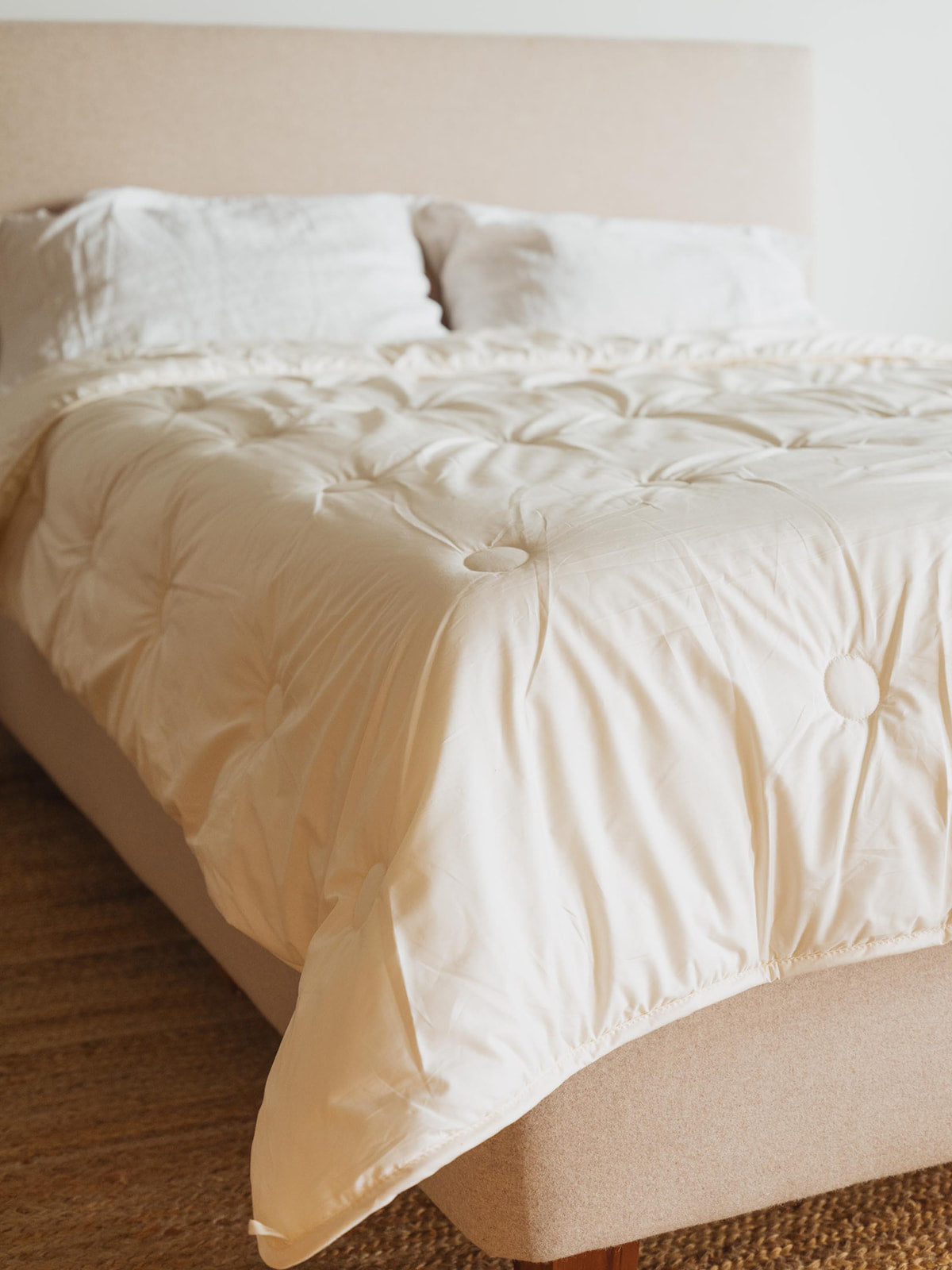 Kakun Organic Wool Comforter - corner shot of made bed