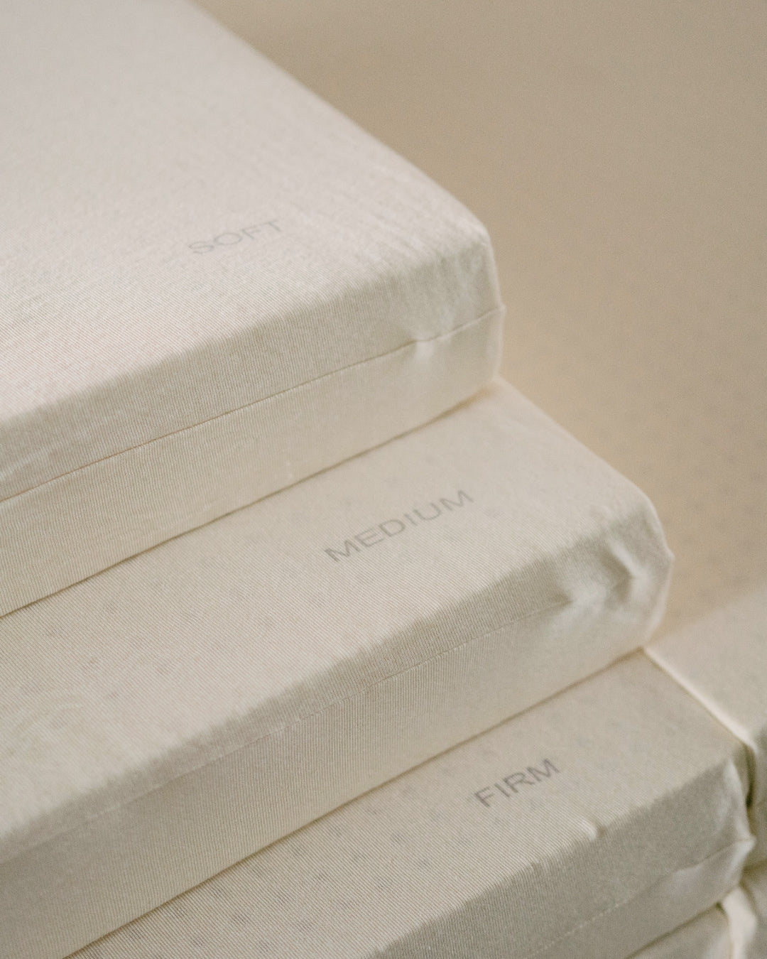 Three organic latex layers stacked on top of each other with 'Soft', 'Medium', and 'Firm' labels.