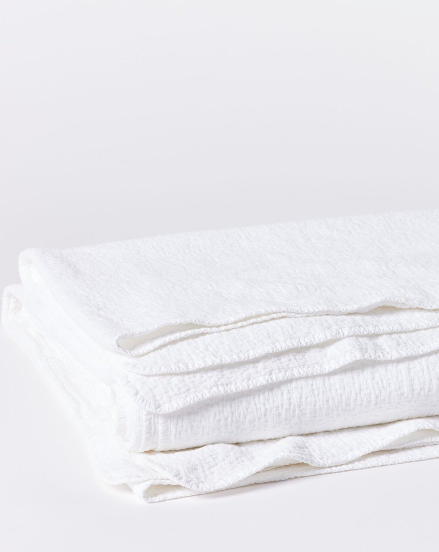 Blanket made with 100% organic cotton is sourced from India and woven in Portugal