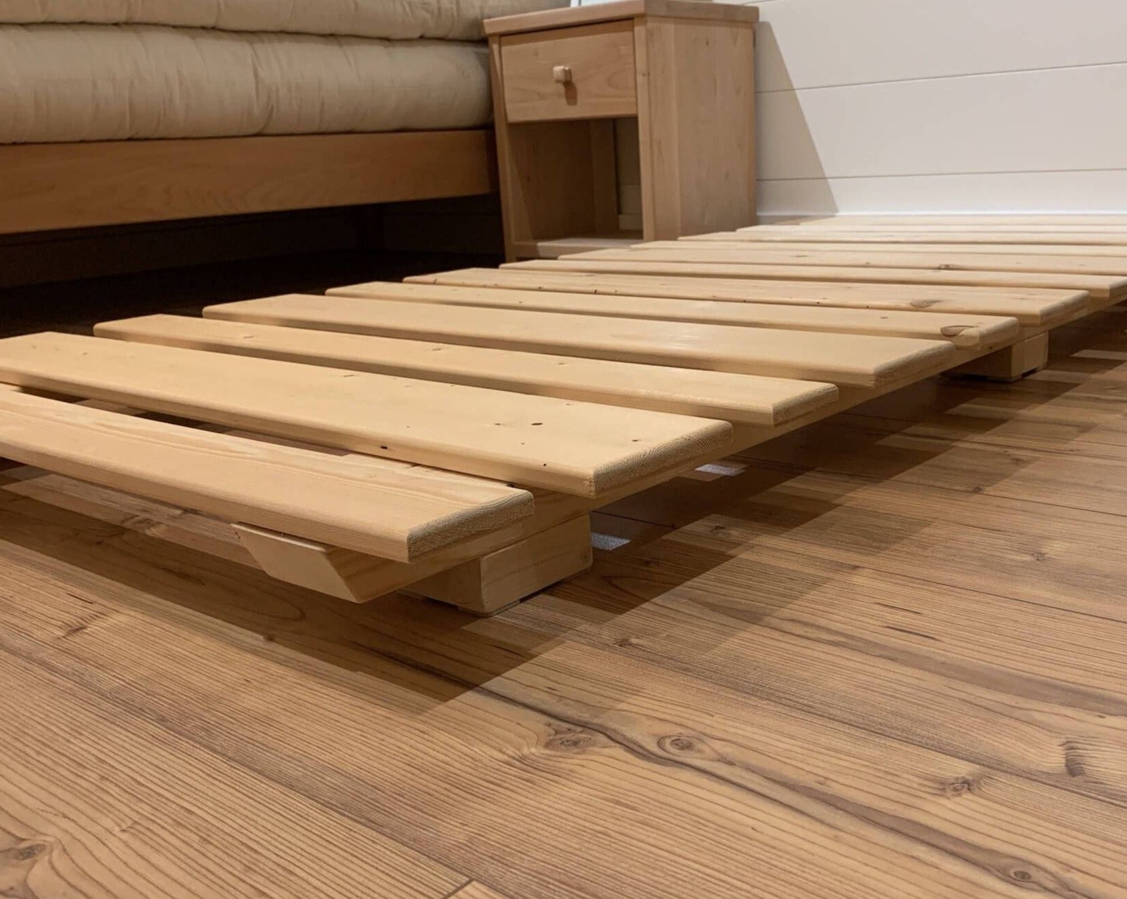 At 2.25” height, the hand-built Simple Slat Base provides a low-profile solution for a grounding sleep experience. Sturdy, untreated wood slats for proper airflow and support.