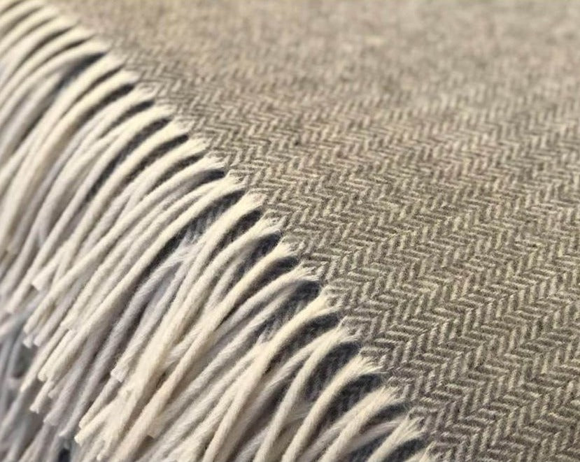 This herringbone throw blanket is breathable, stylish and insulating