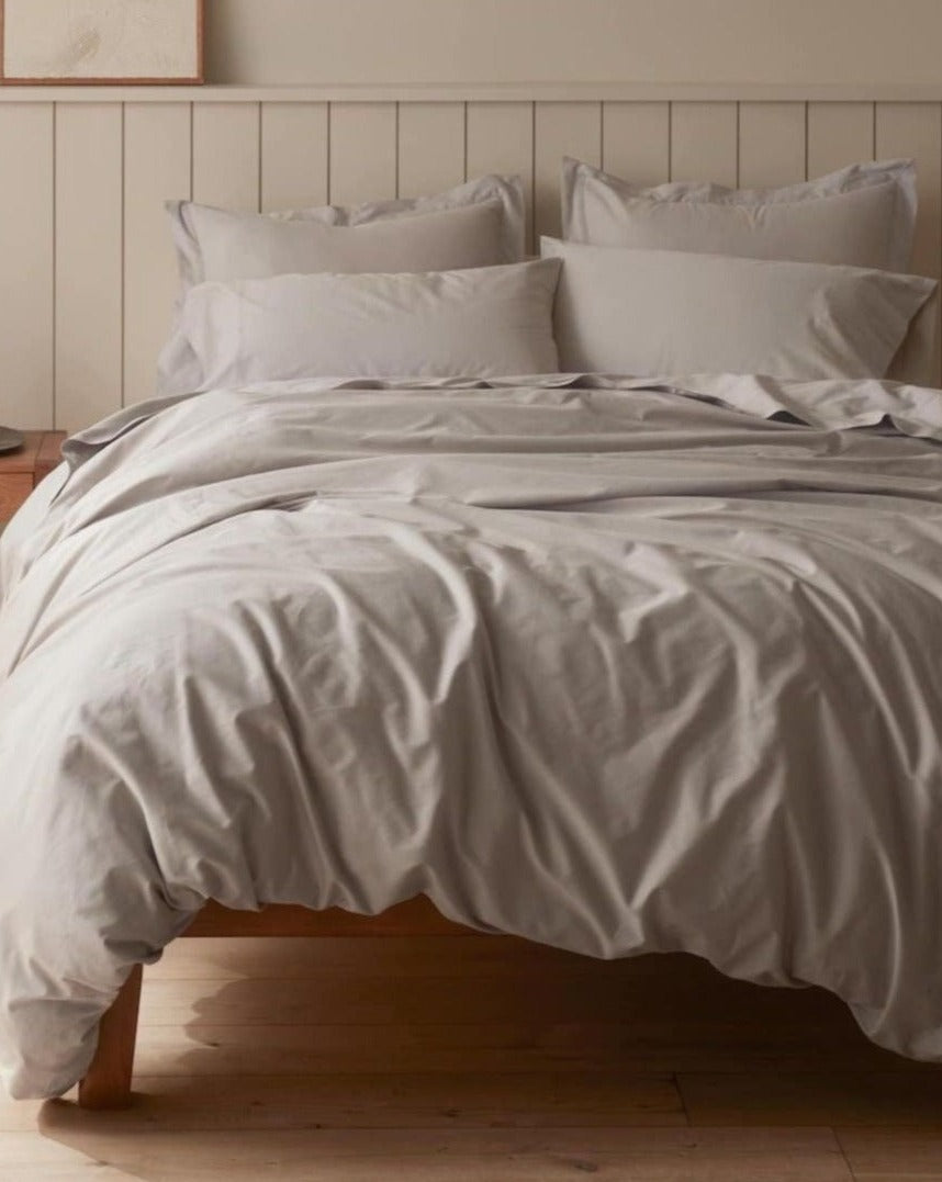 Coyuchi Organic Cloud Soft Sateen Duvet Cover - staged bed #colour_pale gray