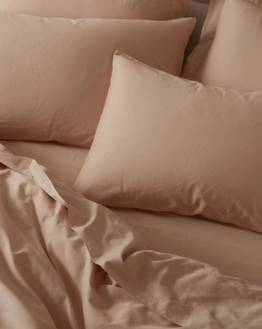 Coyuchi Organic Cloud Soft Sateen Duvet Cover - staged bed with matching pillows #colour_chai