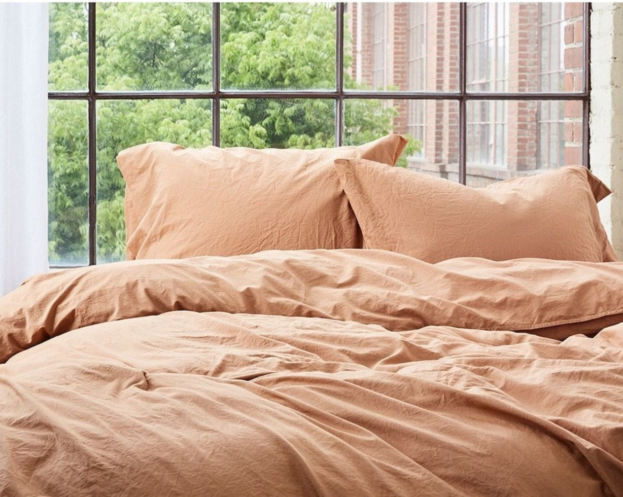 Coyuchi Organic Crinkled Percale Duvet Cover - staged bed #colour_ginger