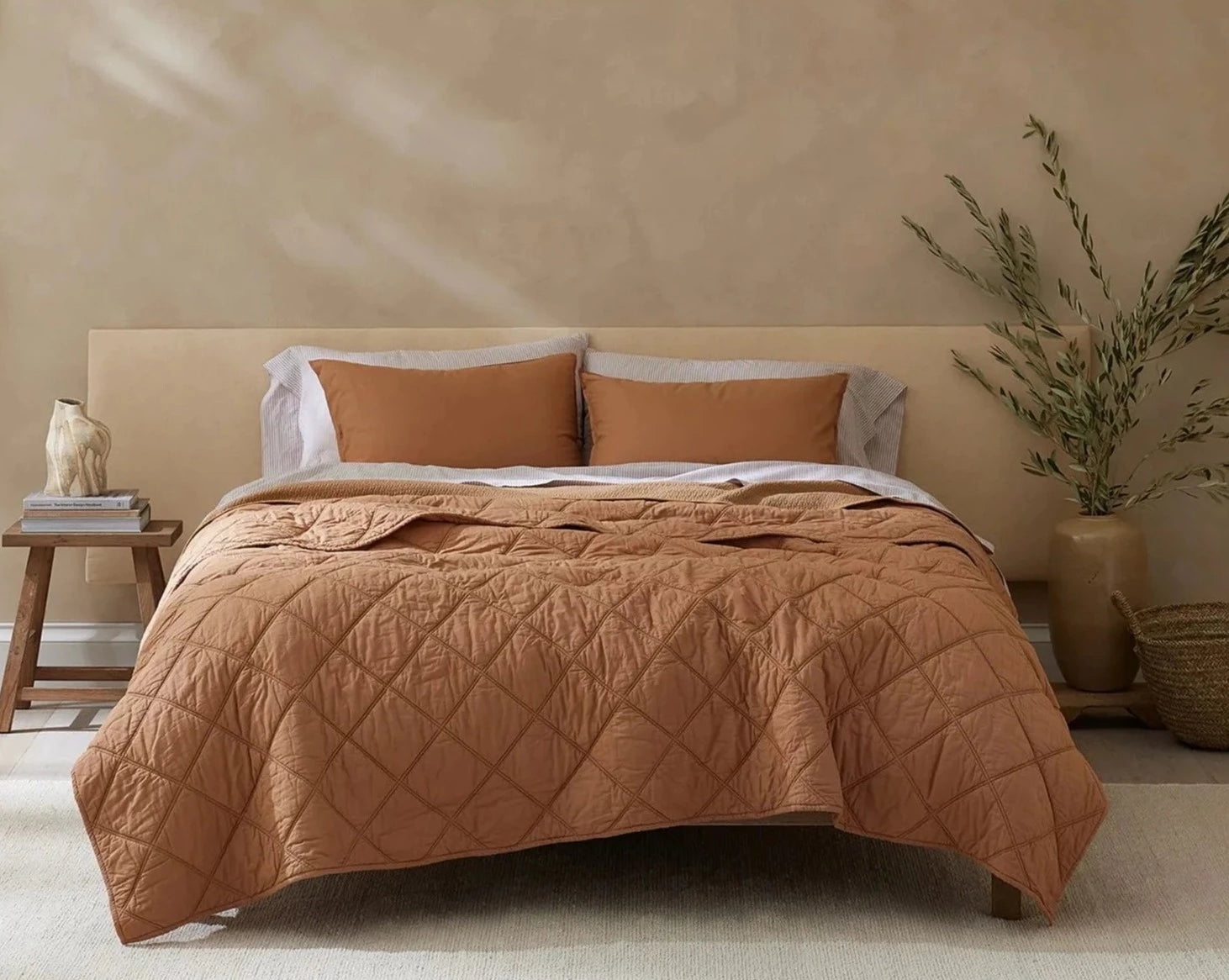 Coyuchi Organic Diamond Stitched Comforter - staged bed soft lighting #colour_ginger