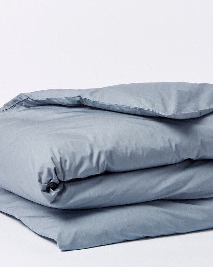 Coyuchi Organic Refined Percale Duvet Cover - folded #colour_steel blue