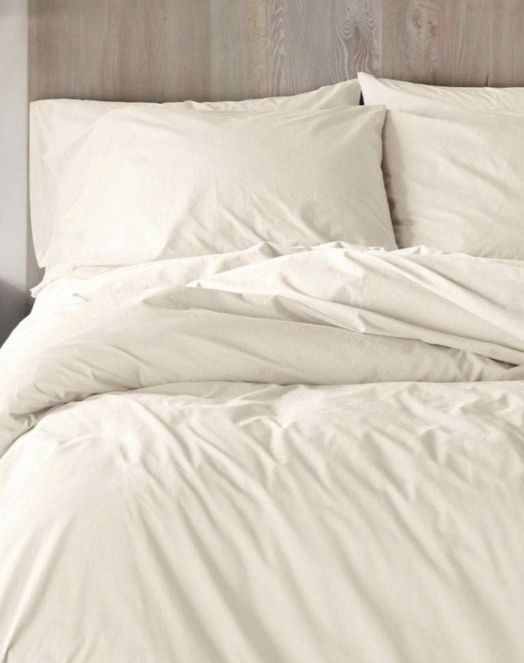 Coyuchi Organic Refined Percale Duvet Cover - staged bed #colour_undyed