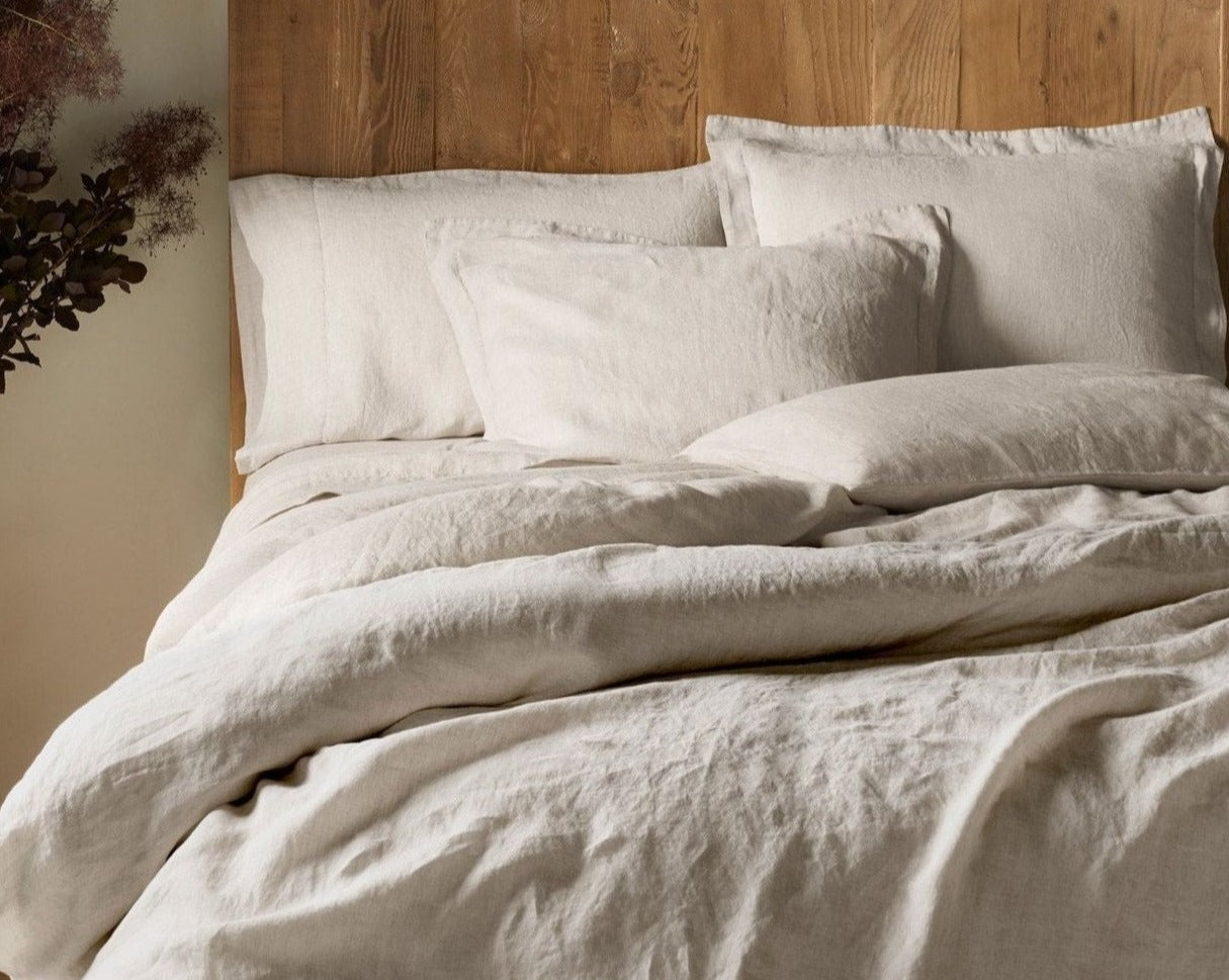 Coyuchi Organic Relaxed Linen Duveet Cover - staged bed showing left side #colour_natural chambray