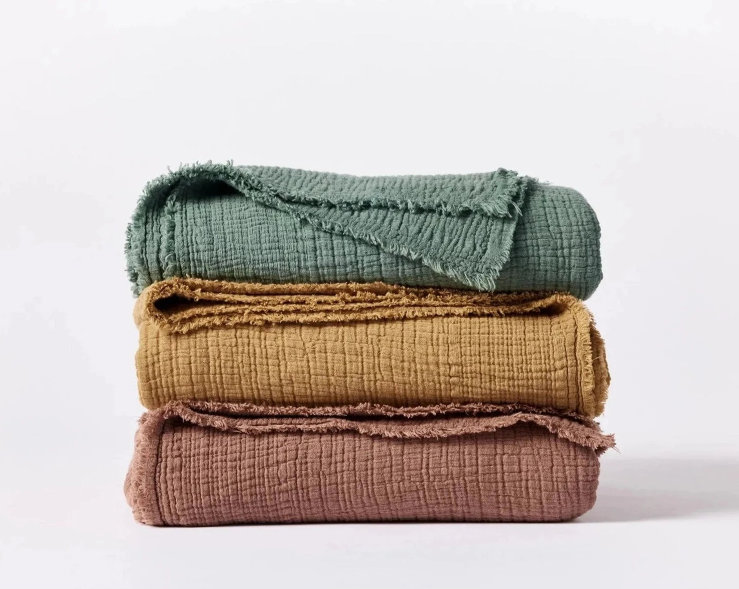 Coyuchi Topanga Organic Cotton Matelasse Throw - three colours stacked